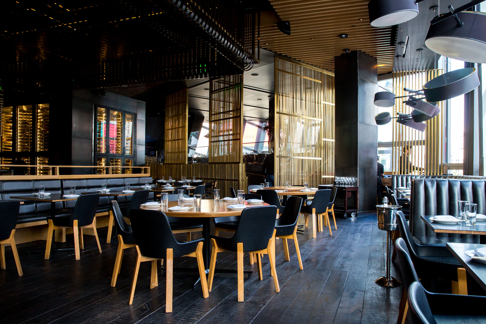 Warm restaurant interior with timber tables and ambient lighting